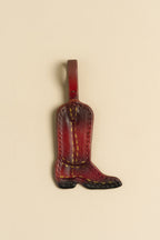 Charm Bota de cuero Arthelier sobre fondo crema