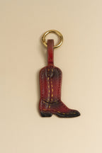 Charm Bota de cuero con correa y argolla dorada